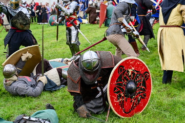 Knight fight, show fight of disguised knights and warriors, medieval soldiers with swords and...