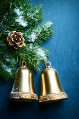 ark blue background for at christmas magazine cover with snow, spruce, bells, top view