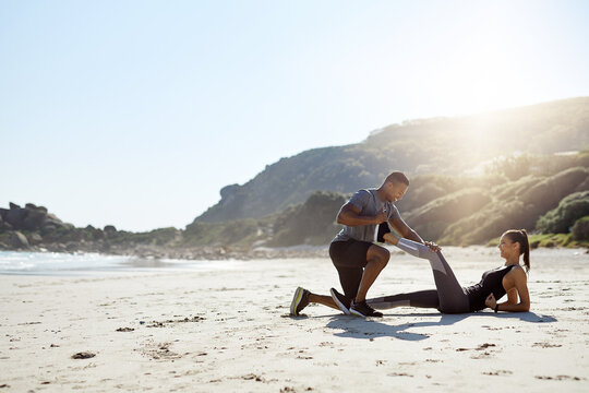 Health, stretching and couple on beach for start of training, fitness and personal trainer. Race, exercise and marathon cardio with people in nature for warm up, sports and running performance - Powered by Adobe