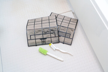 ほこりのついたエアコンフィルター