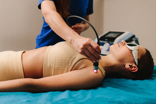 Hand low level laser therapy to promote healing of soft tissues. Infrared treatment of hand to manage pain, numbness and tingling. Doing laser therapy to improve blood flow and immune system.