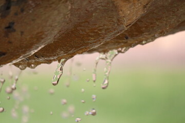 Water dropping from fountain in park. 