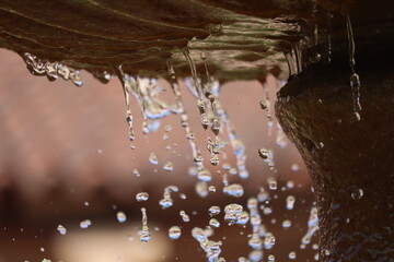 Water dropping from fountain in park. 