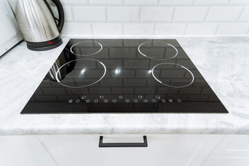 Introducing the Modern Kitchen Induction Cooktop, featuring a sleek design and intuitive touch...