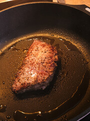 Searing beef brisket steak on an electric stovetop with a hot pan. High quality photo