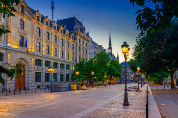 Paris street with lamp lights on sunset twilight in historic city center, Paris cityscape evening...