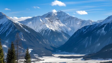 Majestic Snow-Capped Mountains Under Bright Blue Winter Sky with Snowy Valley