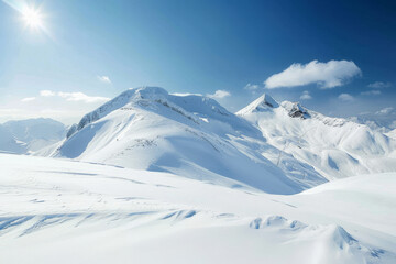 Fototapeta premium A mountain range covered in snow with a clear blue sky