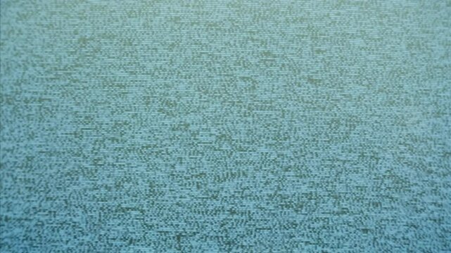 In a nostalgic setup, a retro TV displays static on its screen, reminiscent of an era gone by