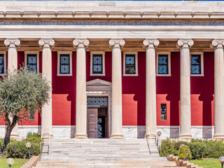Partial view of the columns of Gennadius Library facade. .On the front is written a quote of Isocrates: "Greeks are called those who take part in our own education". Athens, Greece....