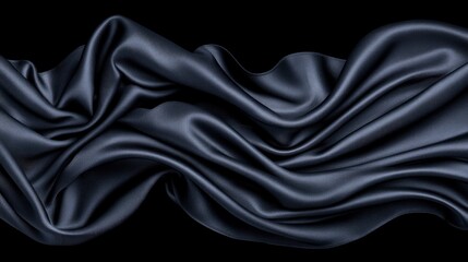 Obraz premium Elegant Black Silk Fabric Draped on Black Background