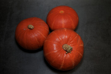 Halloween pumpkins on black. Top view