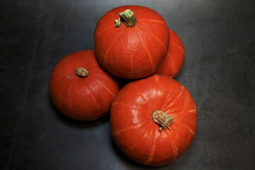 Halloween pumpkins on black. Top view