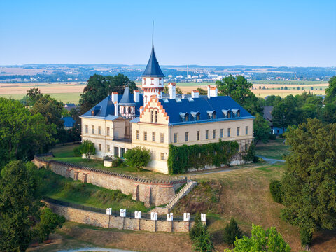 Aerial view of Radun Castle Hidden Among Lush Greenery with Iconic Spire &ndash; Serene Landscape, blue sky, summer time. Ideal for Travel and Architectural Content. Moravia, Czech republic.