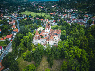 Drone view of Bran Castle, showcasing the medieval fortress and its stunning landscape from above.