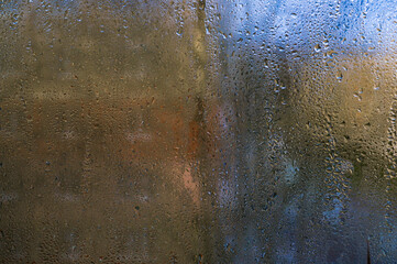 drops of condensation water run down the glass