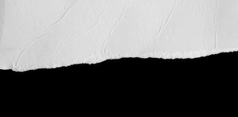 a white piece of paper on a black isolated background