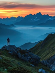 Fototapeta premium A serene mountain landscape at sunrise, with a hiker taking in the view