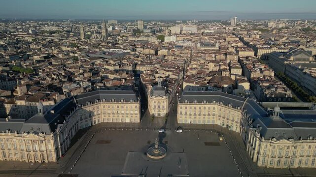 The drone aerial footage of Place de la Bourse and old town of Bordeaux at sunrise, France.	