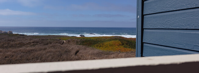 Ocean view from the patio of a blue building 