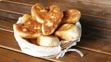 homemade fried pies on a wooden table © Семён Прудий