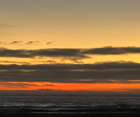Beach Sunset with Rock Silhouette
