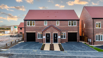 A row of new build homes with sold sign