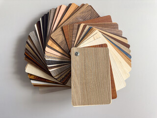 wooden samples on brown desk, close up.