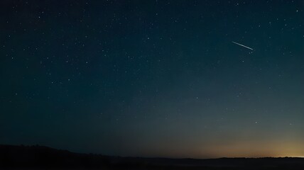 Fototapeta premium Beautiful starry night sky showcasing the Milky Way galaxy, with a sunset on the horizon, providing a breathtaking backdrop of glowing stars, perfect for wallpaper art