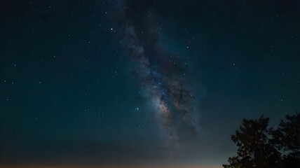 Fototapeta premium Beautiful starry night sky showcasing the Milky Way galaxy, with a sunset on the horizon, creating a stunning backdrop of glowing stars, ideal for wallpaper art
