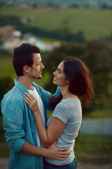 Obraz premium Love, peace and hug with couple in nature for support, bonding and honeymoon vacation. Relax, care and adventure with people and smile on date for travel holiday, marriage and romance together