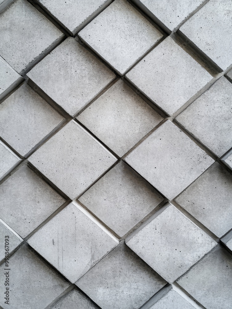 Poster abstract geometric pattern of diamonds on grey concrete wall, representing texture, structure, patte