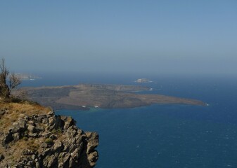 The volcanic islands of Nea and Palaia Kameni inside the flooded caldera of Santorini, Cyclades, Greece