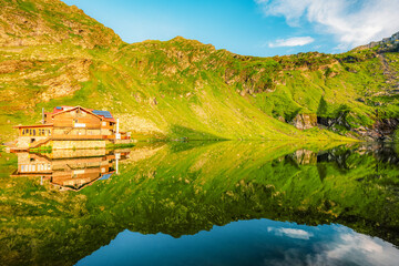 Naklejka premium Fagaras mountains with Balea lake on Transfagarasan serpentine road in Sibiu County, Romania.