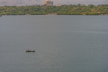 A lone fisherman in the ocean