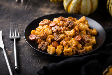 Halloween pasta in shape of spider, bat and pumpkin