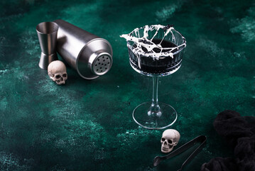 Halloween cocktail with spider cobweb