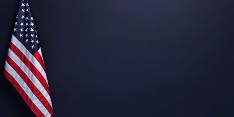 Obraz premium The American flag elegantly displayed on a dark blue background with ample copy space available