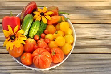 Fresh vegetables from the garden on a wooden background