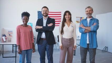 Frontal view of group of multi-ethnic friends standing next to each other. People looking at camera...