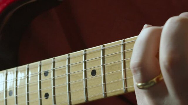 Guitarist Hand Moving Up and Down Fretboard of Stratocaster Guitar Playing Various Chords 4K