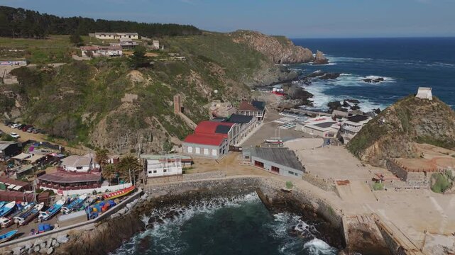 Aerial View of Quintay Museum Foundation, Ex Ballenera Museum, set against the rugged Chilean coastline in Valpara&iacute;so, Chile. Push Forward Shot
