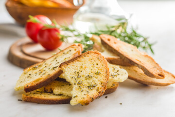 Crispy roasted bruschetta bread on kitchen table.
