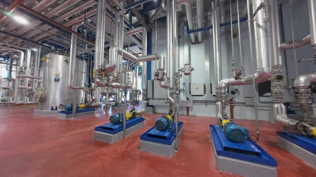 Aerial flight through the facilities of a food processing plant. Dynamic drone shot.
