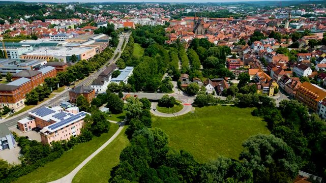 4K Aerial Drone Video of Rezatparkplatz West Parking Lot along the Frankische Rezat River in Ansbach, Germany