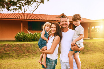 Family, happy and portrait in garden for love, support and pride for new home. Parents, children...