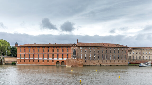 Toulouse, France - September 8, 2024: Hotel Dieu over Garonne river in Toulouse City, France