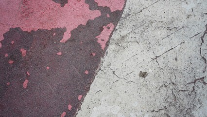 The texture of asphalt with paint scuffs