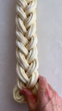 Art of braiding dough to create an exquisite bread loaf