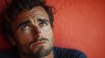 Thoughtful man with skeptical expression.